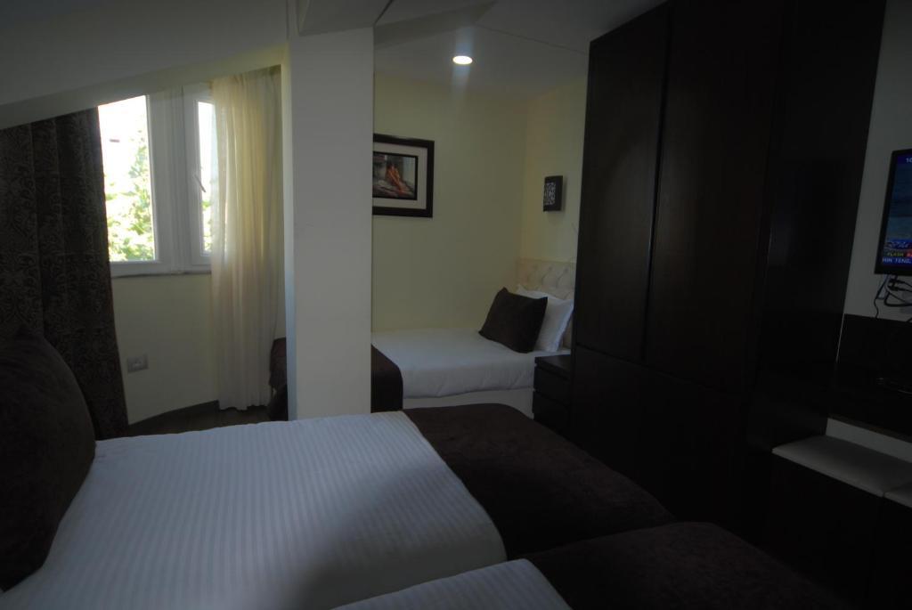 Hotel Town House Tirana Habitación foto